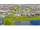 Aerial view of home and community by a lake at 8064 Olive Brook Dr, Wesley Chapel, FL 33545