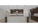 Modern kitchen with stainless steel appliances and an island at 8064 Olive Brook Dr, Wesley Chapel, FL 33545