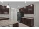 Modern kitchen with stainless steel appliances and an island at 8064 Olive Brook Dr, Wesley Chapel, FL 33545