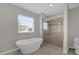 Bathroom with a soaking tub and walk-in shower at 8064 Olive Brook Dr, Wesley Chapel, FL 33545