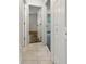 Clean hallway with tile floors and access to bedrooms at 3451 Sage St, Port Charlotte, FL 33948