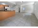 Open concept dining area with tile floor and kitchen access at 3451 Sage St, Port Charlotte, FL 33948