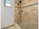 Walk-in shower with tile surround and new fixtures at 3451 Sage St, Port Charlotte, FL 33948