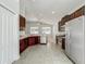 Kitchen with stainless steel appliances and dark wood cabinets at 423 Durham Shore Ct, Apollo Beach, FL 33572