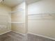 Spacious walk-in closet with ample shelving and hanging space at 423 Durham Shore Ct, Apollo Beach, FL 33572