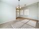 Bright dining room with tile floors and a chandelier at 423 Durham Shore Ct, Apollo Beach, FL 33572