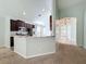 Kitchen boasting granite countertop and breakfast bar at 423 Durham Shore Ct, Apollo Beach, FL 33572