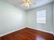 Light-filled bedroom with hardwood floors and window at 423 Durham Shore Ct, Apollo Beach, FL 33572