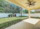 Covered patio with ceiling fan overlooks a fenced backyard at 423 Durham Shore Ct, Apollo Beach, FL 33572