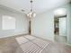 Bright dining room with tile floors and a view into the kitchen at 423 Durham Shore Ct, Apollo Beach, FL 33572