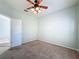 Bedroom featuring hardwood floors and ceiling fan at 423 Durham Shore Ct, Apollo Beach, FL 33572