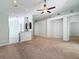 Spacious living room featuring high ceilings and carpet at 423 Durham Shore Ct, Apollo Beach, FL 33572