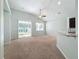 Living area with sliding glass doors and high ceilings at 423 Durham Shore Ct, Apollo Beach, FL 33572