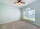 Bedroom with ceiling fan and large window at 423 Durham Shore Ct, Apollo Beach, FL 33572