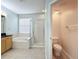 Bathroom with toilet and shower, and access to another room at 423 Durham Shore Ct, Apollo Beach, FL 33572