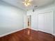 Light and bright bedroom with wood flooring and spacious closet at 423 Durham Shore Ct, Apollo Beach, FL 33572