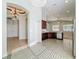 Kitchen with stainless steel appliances and dark wood cabinets at 423 Durham Shore Ct, Apollo Beach, FL 33572