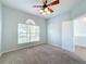 Bedroom with ceiling fan and double doors at 423 Durham Shore Ct, Apollo Beach, FL 33572