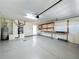 Garage with workbench and extra storage space at 423 Durham Shore Ct, Apollo Beach, FL 33572