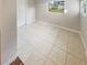 Bright bonus room with tile floors and backyard view at 4405 W Lackland Pl, Tampa, FL 33616