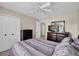 Well-lit bedroom with double bed and dresser at 13504 Prestwick Dr, Riverview, FL 33579