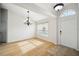 Dining room features hardwood floors and chandelier at 6417 Grapewood Rd, Spring Hill, FL 34609