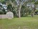 Backyard with barn style shed and fence at 305 Watkins Way, Brandon, FL 33510