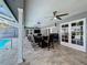 Covered patio with seating area, adjacent to refreshing pool at 6604 Seabird Way, Apollo Beach, FL 33572