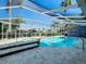 Inviting screened pool and spa with ample deck space at 6604 Seabird Way, Apollo Beach, FL 33572