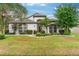 Single-Gathering home with a landscaped lawn and attached garage at 544 Royal Ridge St, Valrico, FL 33594