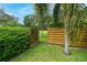 Wooden fence and gate leading to open space at 4450 Golden Lake Dr, Sarasota, FL 34233