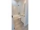 Elegant bathroom with tiled tub, marble wall, and modern vanity at 7137 Benson St, Englewood, FL 34224