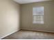Bedroom with neutral walls and window with blinds at 4916 White Sanderling Ct, Tampa, FL 33619