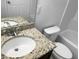 Bathroom with granite countertop vanity, toilet and bathtub at 4916 White Sanderling Ct, Tampa, FL 33619