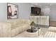 Open living room with contemporary furniture and kitchen view at 4916 White Sanderling Ct, Tampa, FL 33619