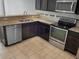 Kitchen with stainless steel appliances and granite countertops at 4916 White Sanderling Ct, Tampa, FL 33619