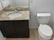 Bathroom with granite countertop vanity and toilet at 4916 White Sanderling Ct, Tampa, FL 33619