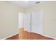 Bright bedroom with wood flooring and access to other rooms at 10407 Villa View Cir # 10407, Tampa, FL 33647