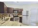 Modern kitchen with granite countertops and stainless steel appliances at 10407 Villa View Cir # 10407, Tampa, FL 33647