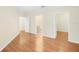 Hardwood floor bedroom with access to bathroom and another room at 10407 Villa View Cir # 10407, Tampa, FL 33647