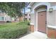 Exterior view of condo building showcasing manicured landscaping and private entrance at 10407 Villa View Cir # 10407, Tampa, FL 33647