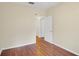 Spacious bedroom with wood flooring and access to hallway at 10407 Villa View Cir # 10407, Tampa, FL 33647