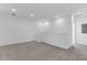 Spacious bonus room with recessed lighting and neutral carpet, ideal for flexible living at 17314 Alderwood Ln, Punta Gorda, FL 33982