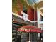 Exterior view of ice cream shop and umbrella-covered patio at 17314 Alderwood Ln, Punta Gorda, FL 33982