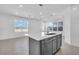 Bright kitchen featuring a center island with a sink and dishwasher, plus recessed lighting throughout the space at 17314 Alderwood Ln, Punta Gorda, FL 33982