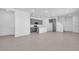 Bright, open-concept living space with modern gray kitchen and abundant natural light at 17314 Alderwood Ln, Punta Gorda, FL 33982