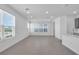 Bright living room featuring recessed lighting, and large windows that provide ample natural light at 17314 Alderwood Ln, Punta Gorda, FL 33982