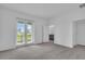 Bright bedroom with balcony access and ensuite bathroom, offering a peaceful retreat at 17314 Alderwood Ln, Punta Gorda, FL 33982