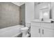 Modern bathroom with tiled shower, toilet, and vanity, offering a functional space at 17326 Alderwood Ln, Punta Gorda, FL 33982