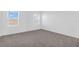Bright bedroom with carpeted floors and natural light creates a serene retreat at 17326 Alderwood Ln, Punta Gorda, FL 33982